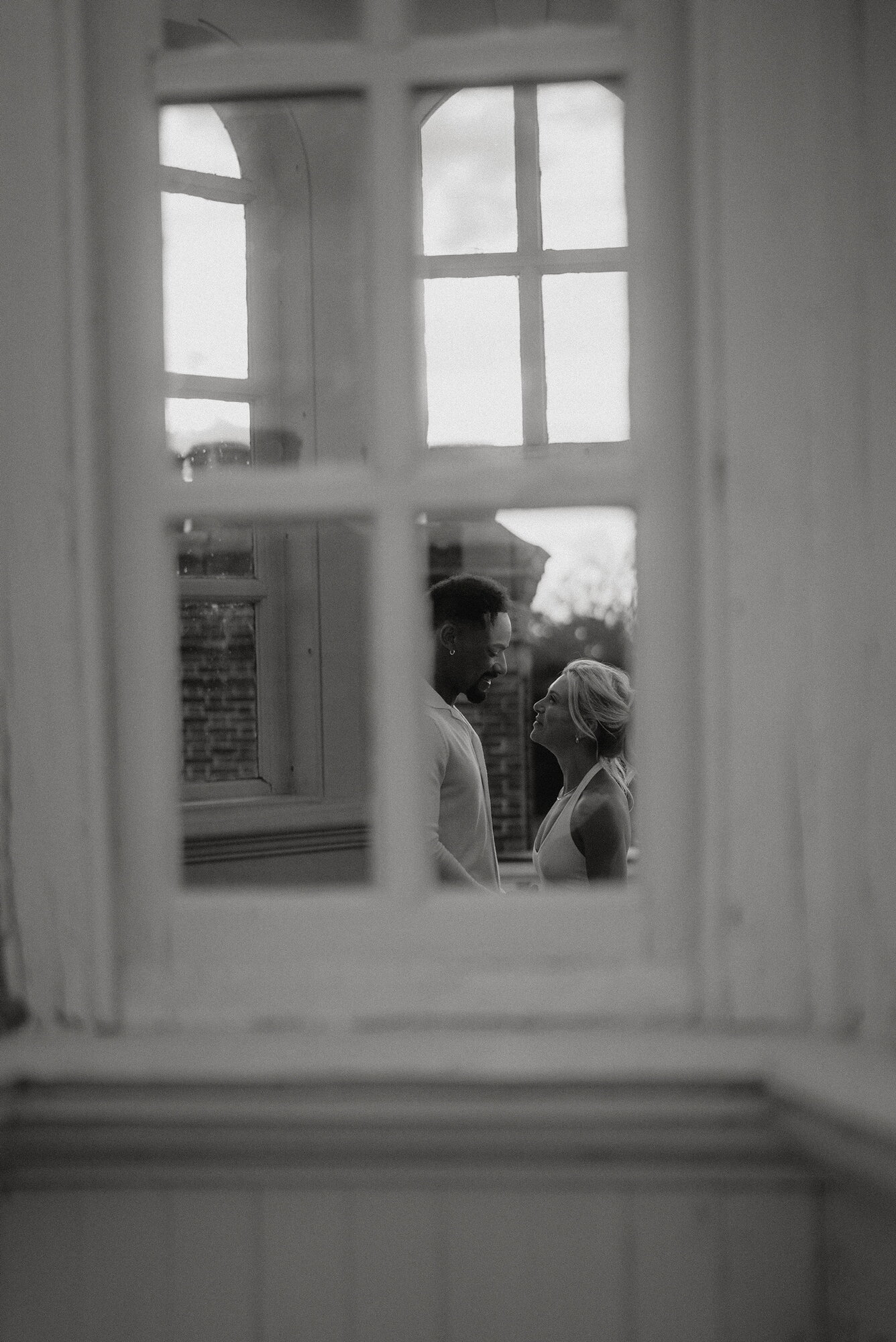 Kayli and Chris seen through a window